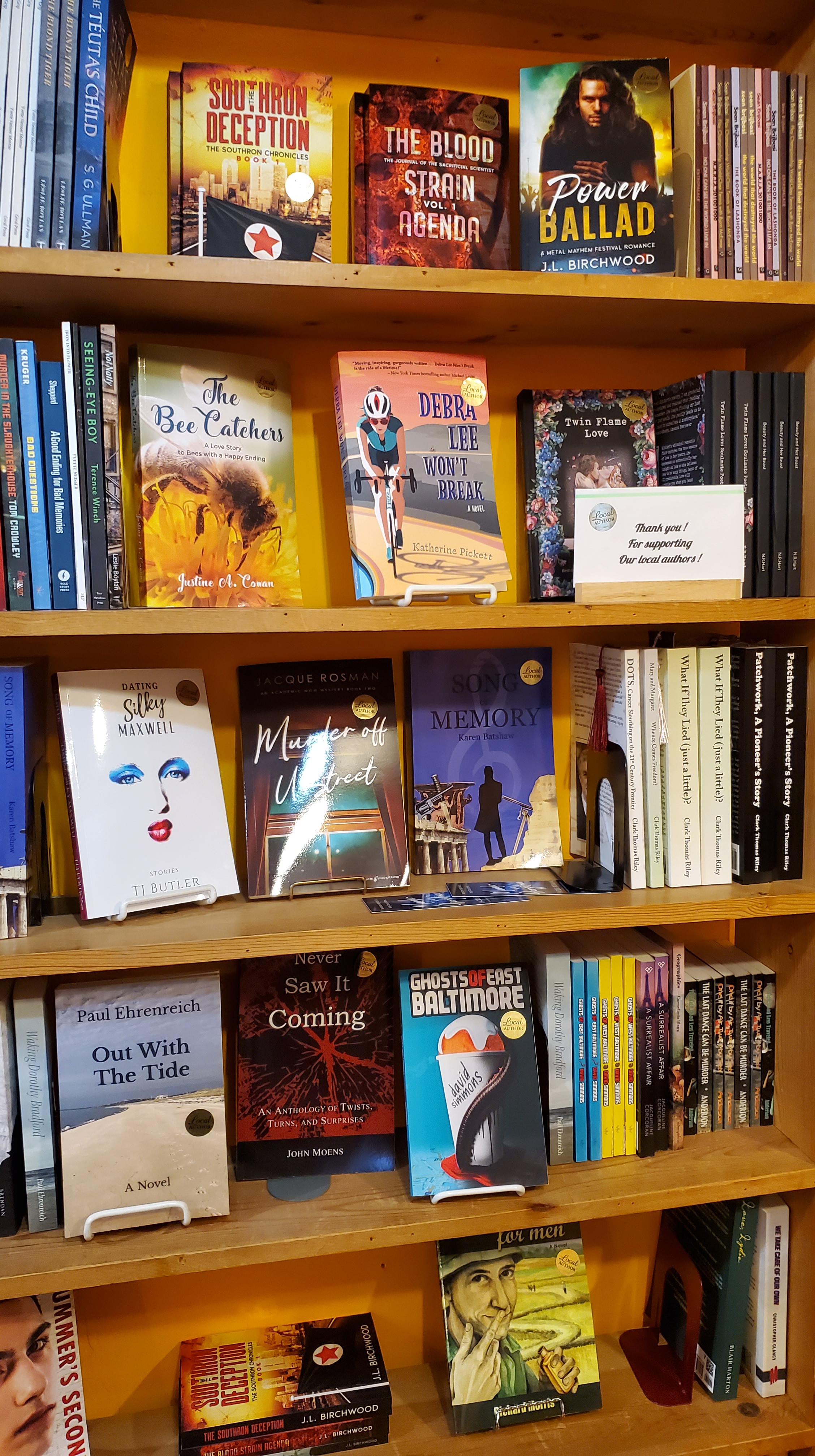 Debra Lee Won't Break on a bookcase surrounded by other books. Each book has a sticker that reads "Local Author"